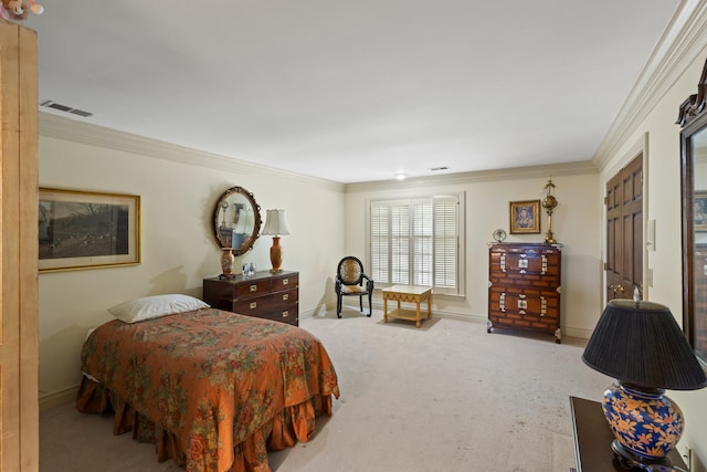 bedroom with carpet floors and crown molding