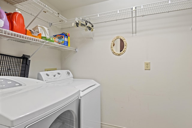 laundry room with washing machine and dryer