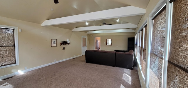 unfurnished living room featuring lofted ceiling with beams, carpet flooring, and ceiling fan