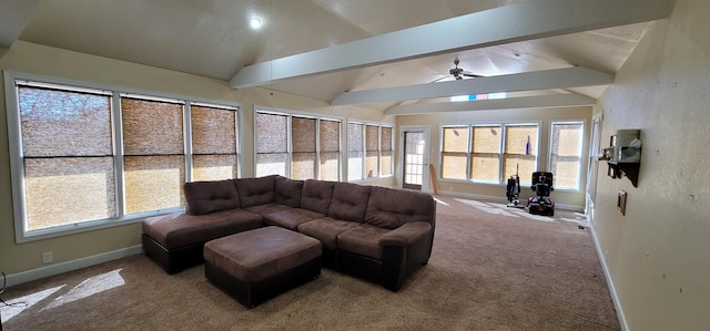 living room featuring carpet floors, vaulted ceiling with beams, and a healthy amount of sunlight