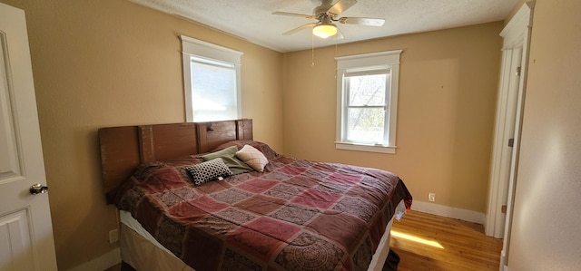 bedroom featuring ceiling fan and light wood-type flooring