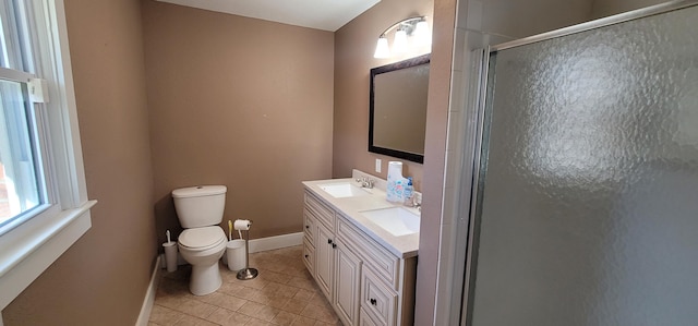 bathroom with walk in shower, vanity, toilet, and tile patterned flooring