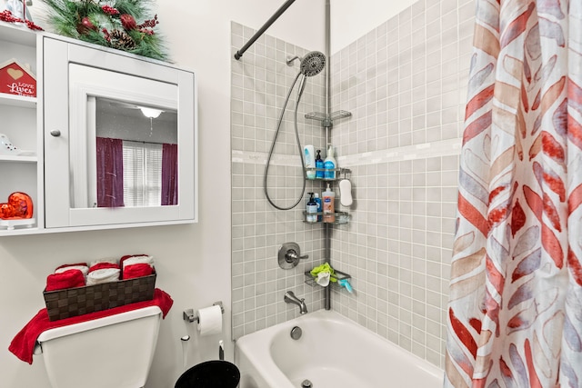 bathroom featuring shower / bath combo and toilet