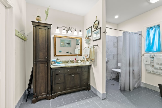 bathroom featuring walk in shower, tile flooring, and oversized vanity