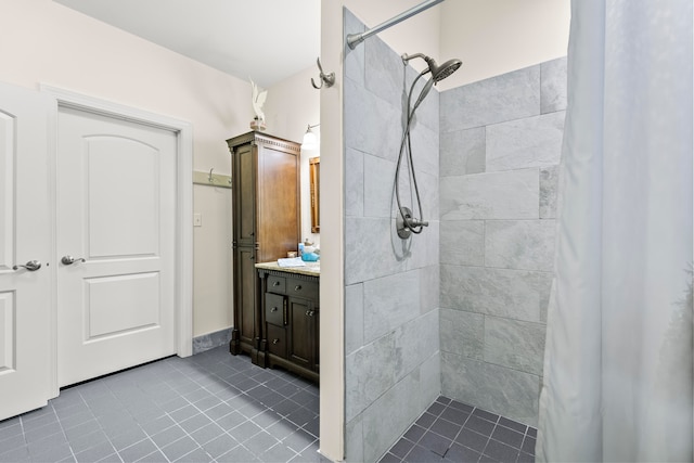 bathroom featuring tile flooring, vanity, and a shower with curtain