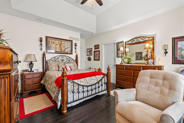 bedroom featuring a high ceiling, ceiling fan, and dark wood-type flooring