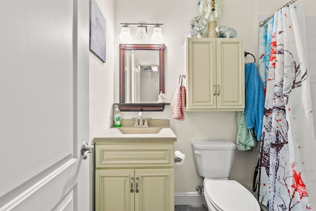 bathroom with toilet and vanity