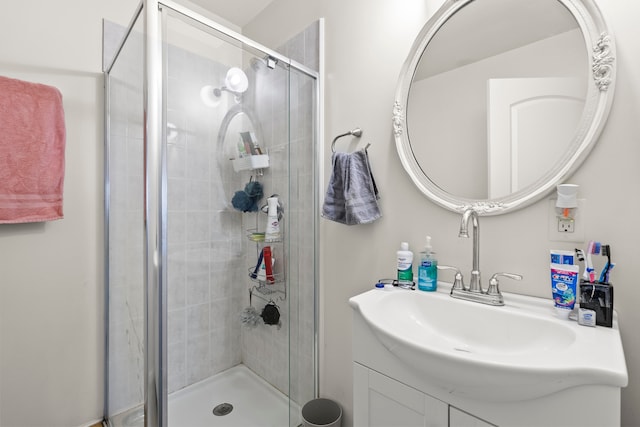 bathroom featuring an enclosed shower and vanity