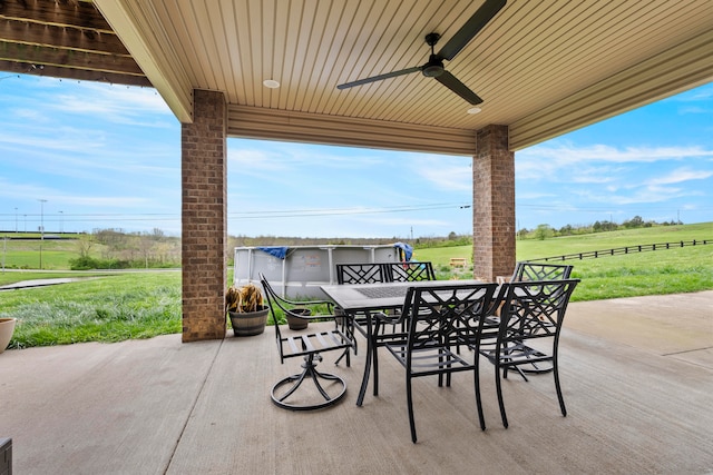 view of patio / terrace with a rural view and ceiling fan