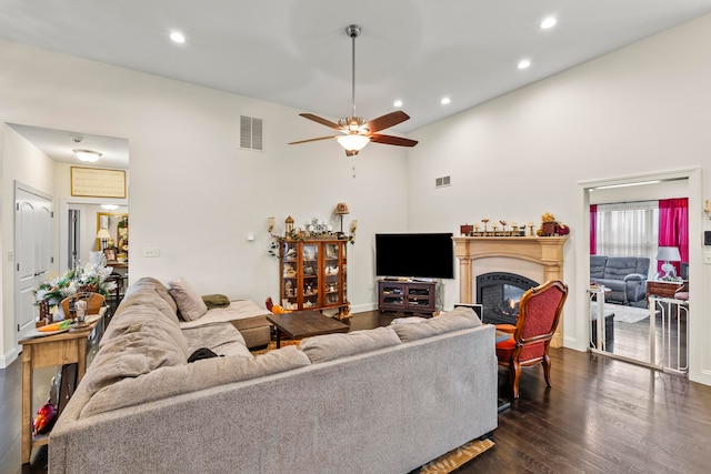 living room featuring high vaulted ceiling, dark hardwood / wood-style floors, and ceiling fan