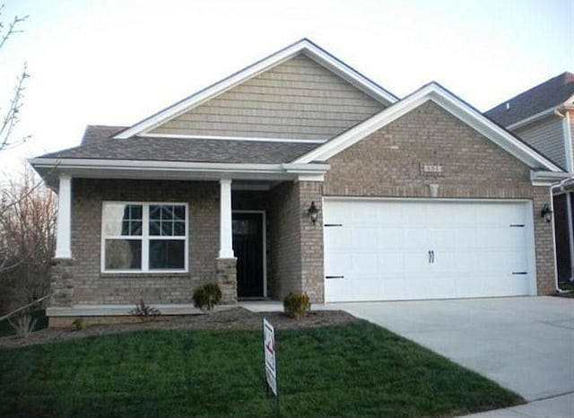 craftsman-style house with a front lawn and a garage