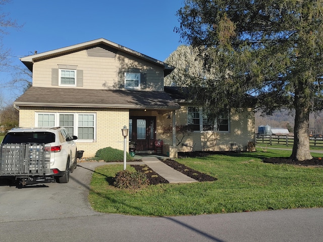 view of front facade with a front yard