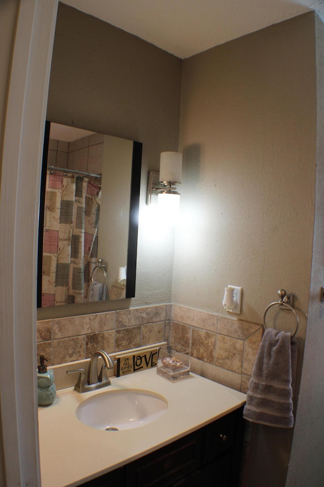 bathroom with backsplash and vanity