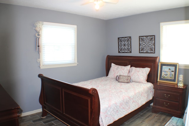 bedroom featuring ceiling fan and dark hardwood / wood-style flooring