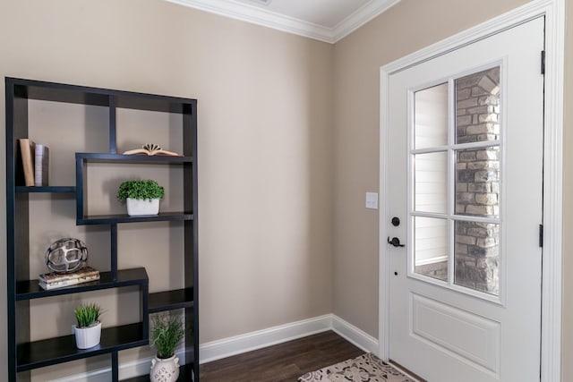 entryway with dark hardwood / wood-style flooring and ornamental molding