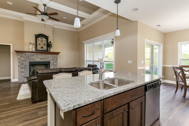 kitchen featuring coffered ceiling, stainless steel dishwasher, decorative light fixtures, dark wood-type flooring, and sink