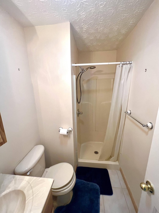 bathroom with curtained shower, tile patterned flooring, a textured ceiling, toilet, and vanity