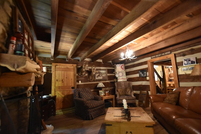 living room with beamed ceiling, dark hardwood / wood-style floors, a chandelier, and wooden ceiling