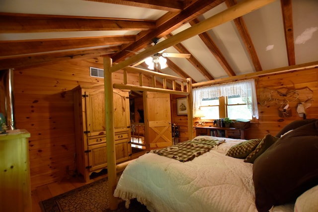 bedroom with wood walls, wood-type flooring, and lofted ceiling with beams