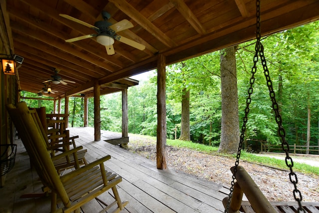 wooden deck featuring ceiling fan