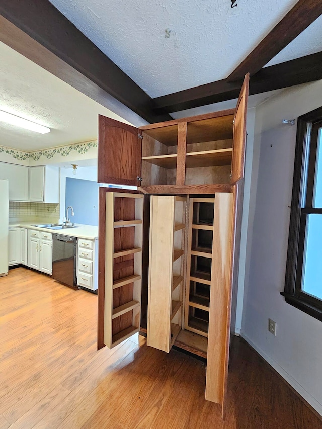 interior space with light hardwood / wood-style flooring and sink