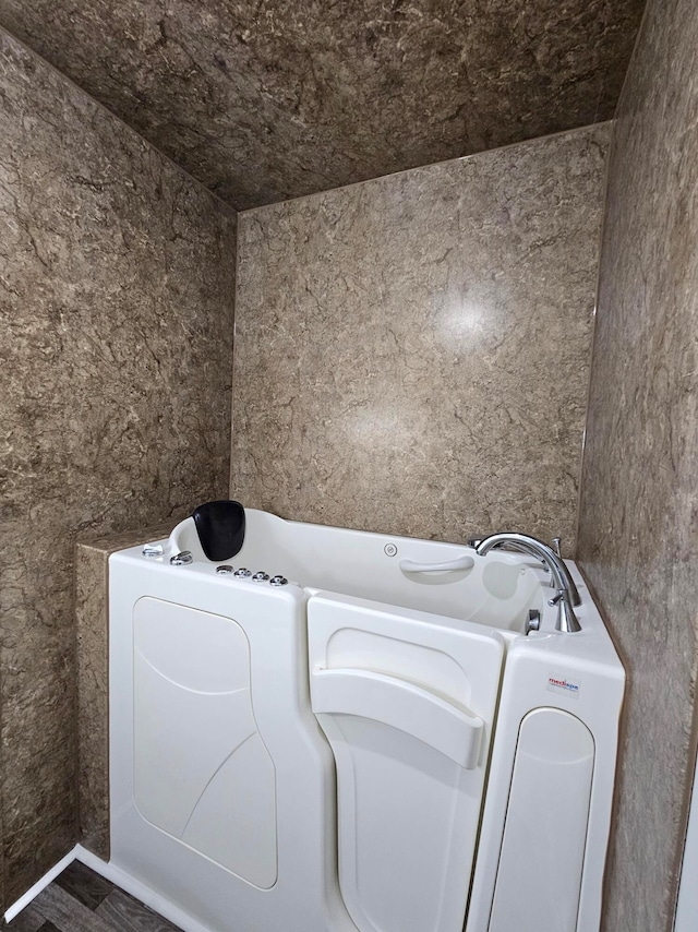 laundry area with washer / dryer and hardwood / wood-style flooring