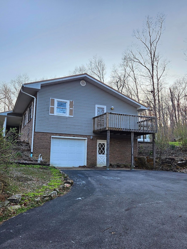 exterior space featuring a deck and a garage