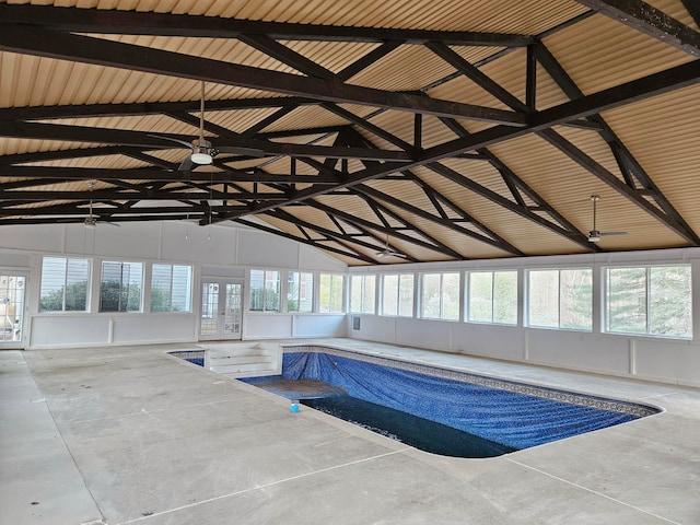 view of pool with ceiling fan and a jacuzzi