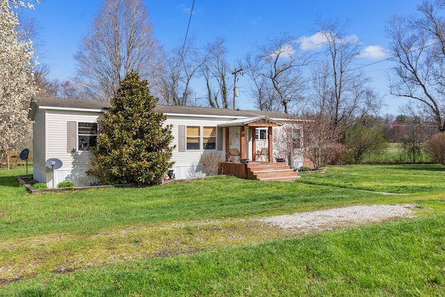 ranch-style home with a front lawn