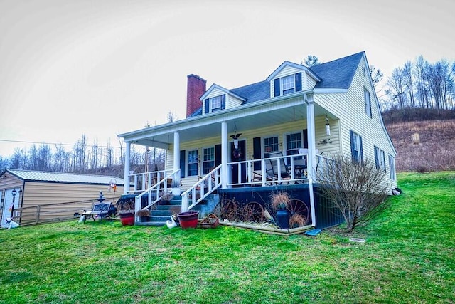 back of house with a porch and a lawn