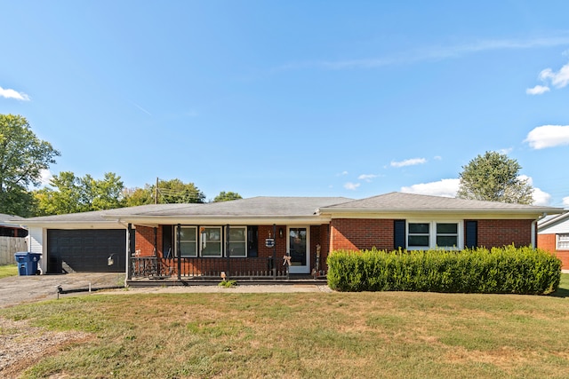 single story home featuring a garage, a front lawn, and a porch