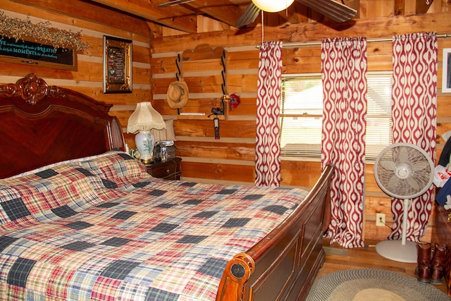 bedroom with hardwood / wood-style flooring