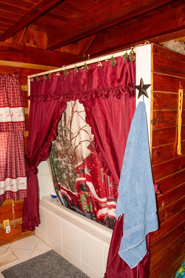 bathroom with shower / bath combo with shower curtain