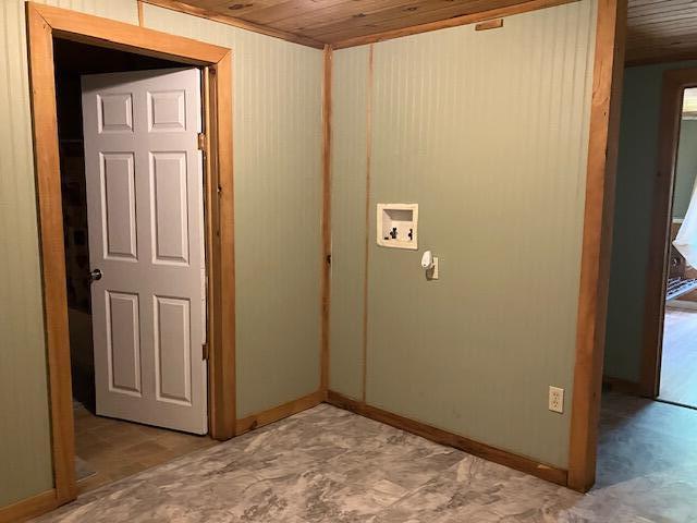 laundry room featuring wooden ceiling, light tile patterned floors, and hookup for a washing machine