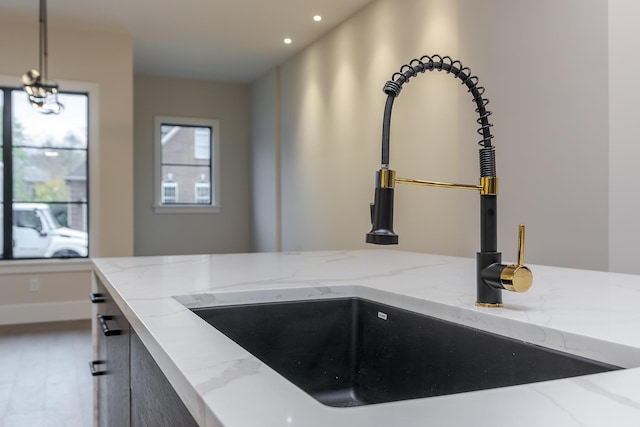 2420 Flying Ebony Dr, Lexington, KY 40509 - kitchen with wood finished floors, a sink, light stone counters, and recessed lighting