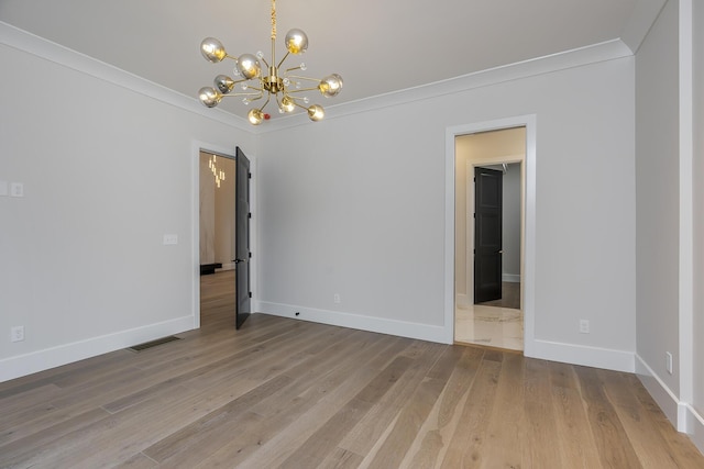 2420 Flying Ebony Dr, Lexington, KY 40509 - spare room with visible vents, crown molding, baseboards, wood finished floors, and an inviting chandelier