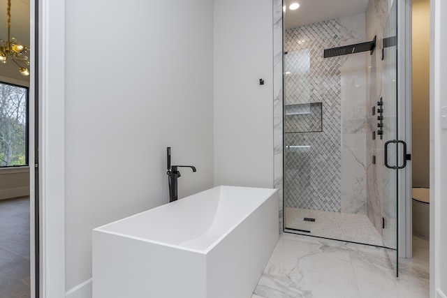 2420 Flying Ebony Dr, Lexington, KY 40509 - full bath featuring marble finish floor, a freestanding tub, and a stall shower