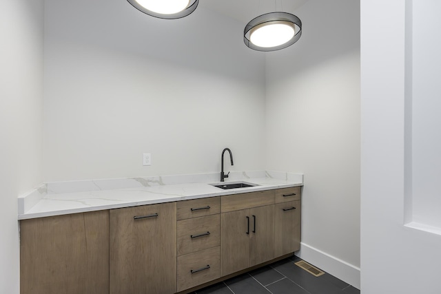 2420 Flying Ebony Dr, Lexington, KY 40509 - interior space featuring baseboards, visible vents, a sink, and dark tile patterned floors