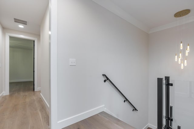 2420 Flying Ebony Dr, Lexington, KY 40509 - hall with crown molding, an upstairs landing, light wood-type flooring, baseboards, and visible vents