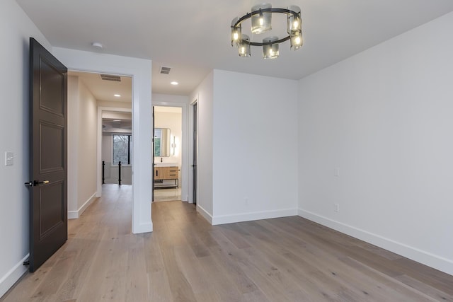 2420 Flying Ebony Dr, Lexington, KY 40509 - unfurnished dining area featuring an inviting chandelier, light wood-style flooring, baseboards, and visible vents