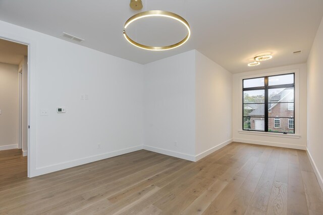 2420 Flying Ebony Dr, Lexington, KY 40509 - empty room featuring baseboards, visible vents, and light wood-style flooring