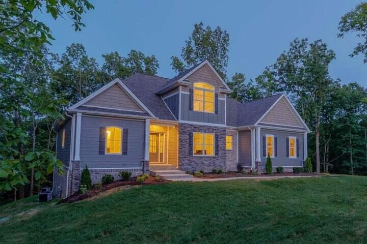 craftsman-style house with a front lawn