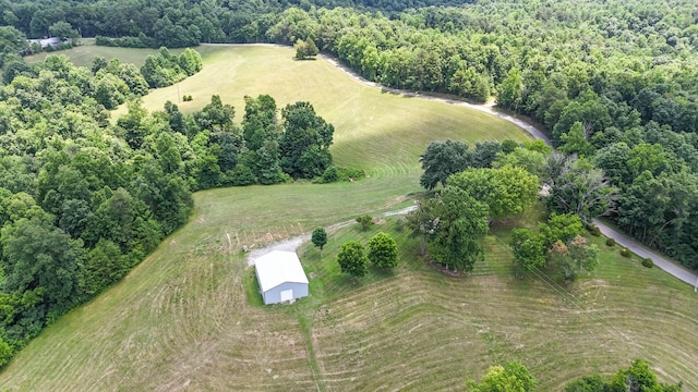 aerial view featuring a wooded view