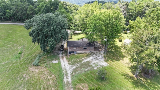 drone / aerial view with a view of trees