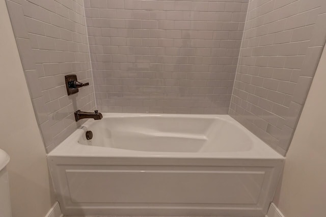 bathroom featuring washtub / shower combination