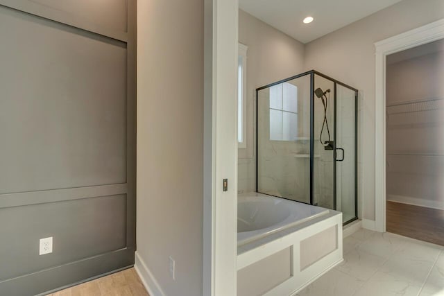 bathroom featuring plus walk in shower