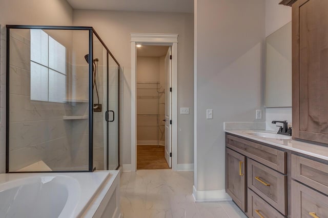 bathroom featuring vanity and separate shower and tub