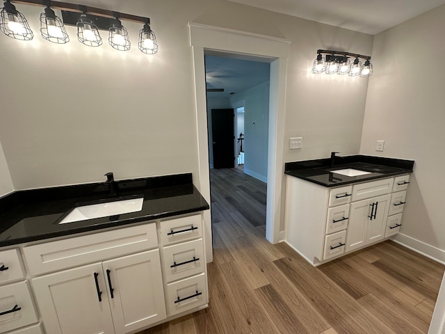 bathroom featuring wood-type flooring and vanity