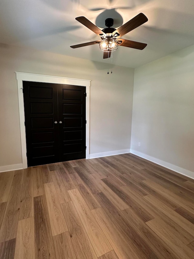 spare room with ceiling fan and light hardwood / wood-style flooring