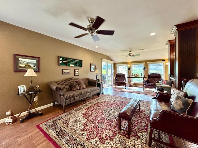 living room with ceiling fan and light hardwood / wood-style floors